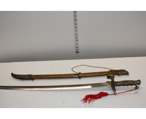 A reproduction sword and scabbard. postage unavailable 