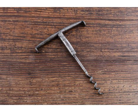 An English late 18th Century double folding corkscrew, bevelled with fluted shank, grooved helix and strong springs with pipe