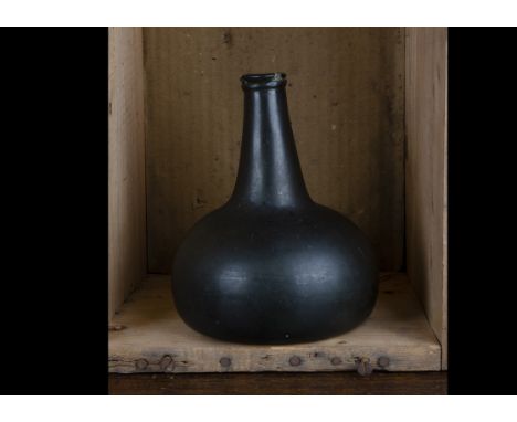 Dutch utility wine bottle circa 1720-50, onion shape, blow pipe pontil scar, dark green colour, 17.5cm, chip just below lip