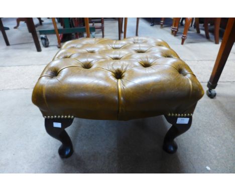 A mahogany and olive green leather Chesterfield foot stool 
