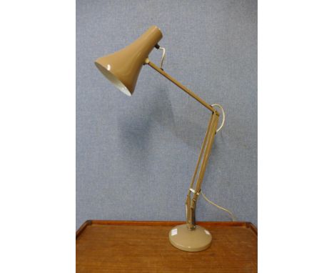 A beige metal anglepoise desk lamp 