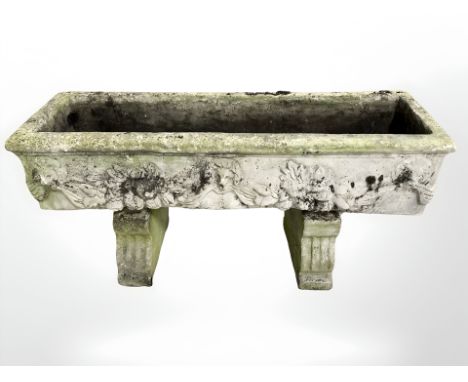 A weathered concrete rectangular raised planter, 90 cm wide 