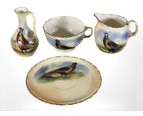 A Locke & Co. Worcester tea cup, saucer, milk jug and a further jug, all decorated with pheasants, tallest 9 cm.