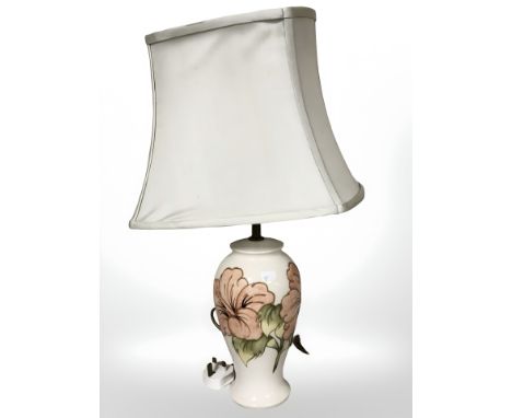 A Moorcroft table lamp with shade, height 57 cm.