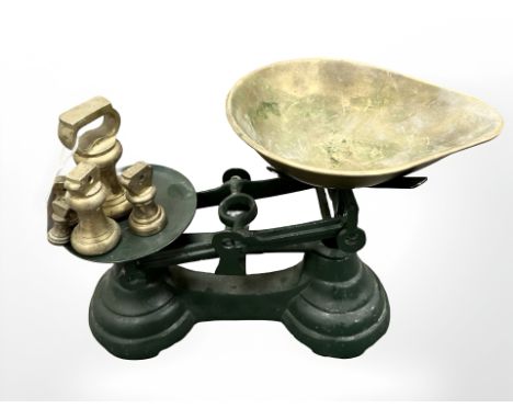 A set of scales with brass pan and weights 