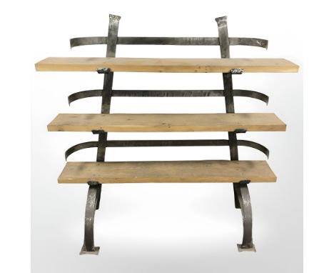A wrought metal and pine contemporary book shelf, width 128 cm.