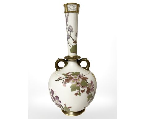 A Royal Worcester blush ivory twin handled vase with pierced tapering neck, height 33.5 cm.