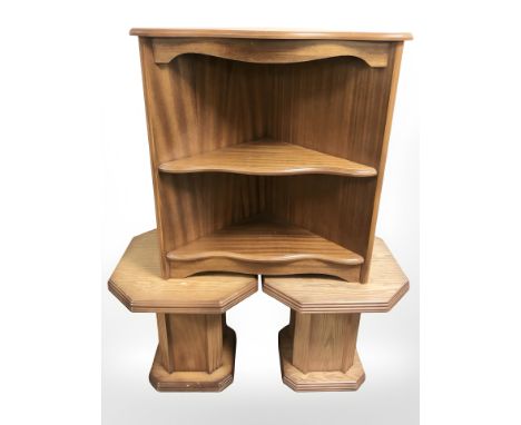 A reproduction corner shelf and a pair of octagonal tables.