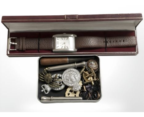 A small tray containing police badges, cheroot,  9ct gold 'front and back' tie clip with cufflinks, a gent's stainless steel 