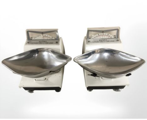 Two sets of enameled grocers scales.