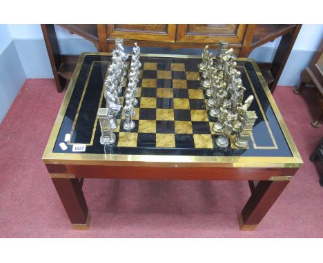 A Mahogany Brass Bound Games Table, with chess bound top, brass border on square supports, united by H stretcher, together wi
