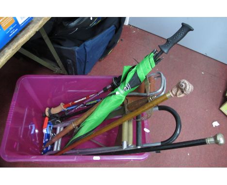 A Collection of Trekking Poles, walking sticks, shooting sticks, vintage climbing axe and miscellaneous items.