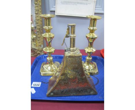 Leather and Brass Shot Flask, of curved triangular form with mermaid and figural decoration and lion mask handles, 21cm high,