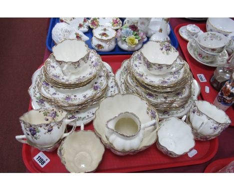 Melba China Early XX Century Tea Service, with forget-me-not flowers and gilt highlights, thirty-six pieces.