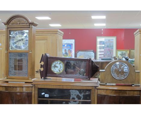 Highlands Oak Cased Wall Clock, one other wall clock; together with an oak mantle clock. (3)
