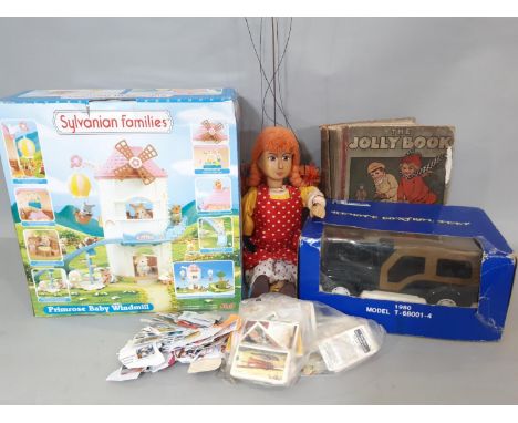 Mixed toy lot including Sylvanian Families 'Primrose Baby Windmill' (unchecked), wooden puppet in clogs, 'The Jolly Book' by 