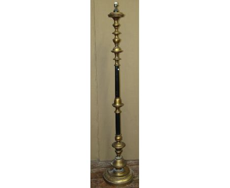A lamp standard in a black and gilded colourway 
