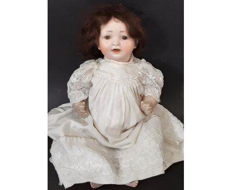 Small early 20th century bisque head character doll with composition bent limb body, closing brown eyes and open mouth with 2