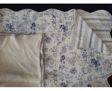 Machine made reversible quilt with toile de jouy type print on one side and contrasting stripe verso 2.55x2m together with a 