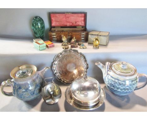 A miscellaneous collection of items including two studio pottery teapots, a green glass dump, a walnut domed glove box with a