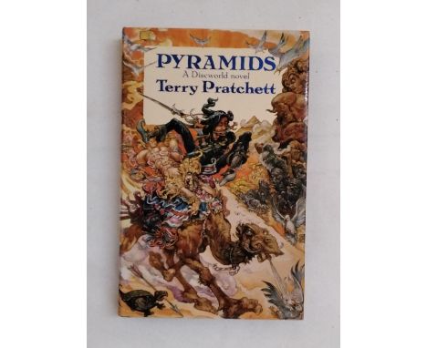 Pratchett, Terry - Pyramids, first edition 1989 and signed by the author (1) (displayed in cabinet upstairs) 