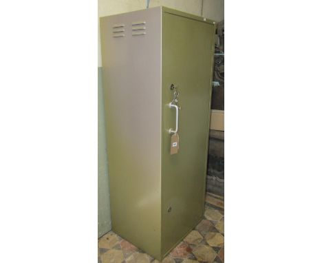 A light sage green painted heavy gauge steel floorstanding gun cabinet enclosed by a full length rectangular door with two lo