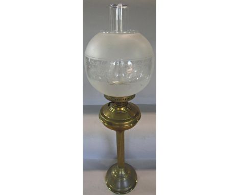 A 19th century brass reeded column oil lamp, with a semi opaque glass shade and chimney, 70cm high approx, a walking stick wi