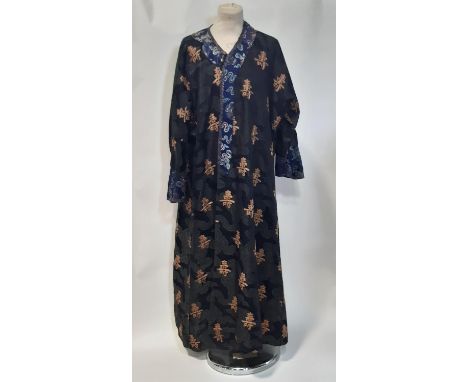 Oriental vintage kimono gown made of patterned black silk embroidered with goldwork characters and lined in blue silk. Neckli