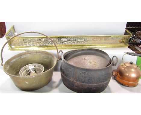 A 19th century pierced brass fender, 122cm wide, a brass conserving pan, a vintage copper electric kettle, a cast iron cookin