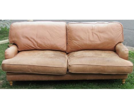 A Sofa Workshop contemporary low deep seated light brown leather upholstered sofa, loosely in the Howard style, with loose se