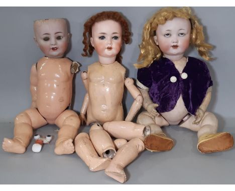 Three early 20th century German bisque head dolls for restoration and re-stringing comprising; baby doll by Otto Gans for Arm