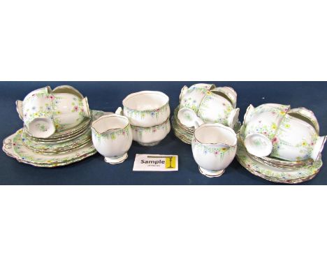 A collection of Royal Albert Lynton pattern tea wares comprising twelve cups, eleven saucers, twelve side plates, two cake pl