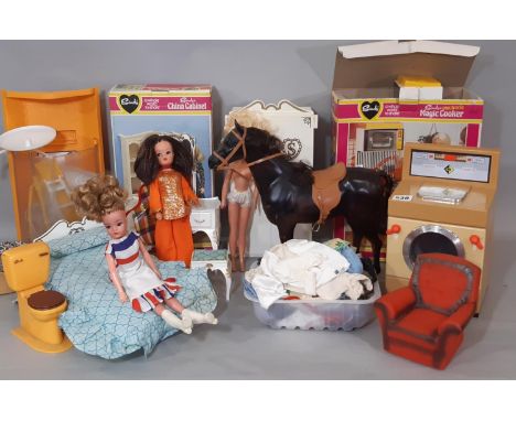 A collection of vintage Sindy dolls and Sindy furniture comprising shower , China Cabinet, Magic Cooker (not tested), bedroom