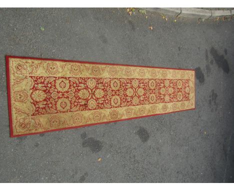A Wilton type runner with a Middle Eastern pattern, 275cm x 64cm approx. 