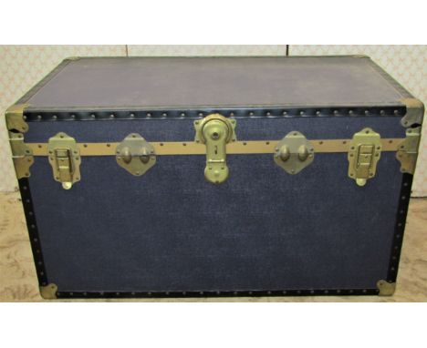 An overpond cabin trunk, together with two green painted tin trunks with drop side handles (3)