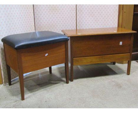A 1970s teak sewing box stool with hinged upholstered lid raised on tapered supports, together with a further example with hi