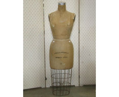 A vintage tailor's dummy/mannequin, Wolf Model Form Company, collapsible model 1970 female torso, raised on an open steel fra