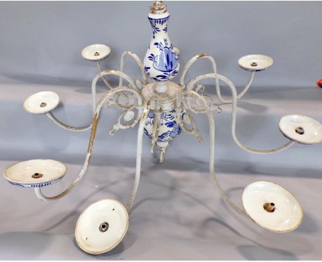 An eight branch blue Delftware ceiling light with a white painted finish over the original gold metal finish, together with a