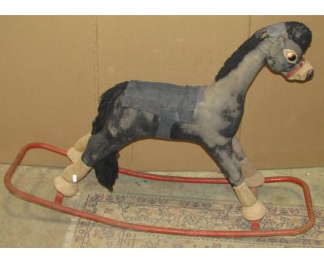 A vintage Merrythought child's rocking horse, plush fabric covered and mounted on a painted tubular frame and a chair (af) 