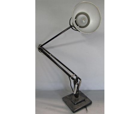 A mid 20th century black Anglepoise lamp on a stepped base, stamped Made in England, Herbert Terry &amp; Sons Ltd Redditch. 