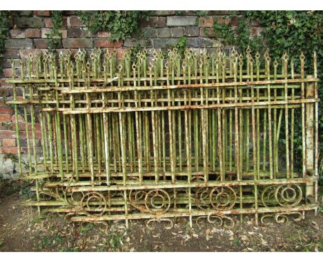 Eight sections of 19th century wrought iron railing with vertical cylindrical solid bars with pierced shaped finials, circle 