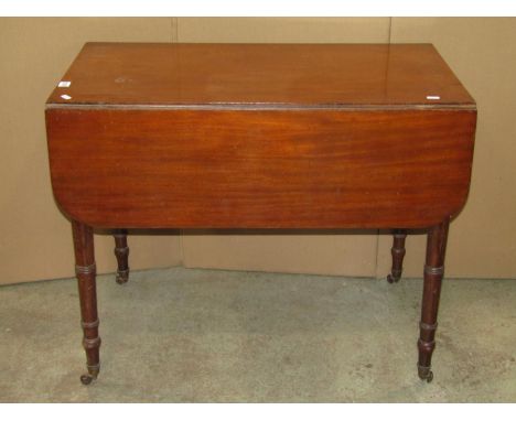 A Victorian mahogany Pembroke table on turned supports, an oval inlaid Edwardian wall mirror and an oak lamp standard on spir