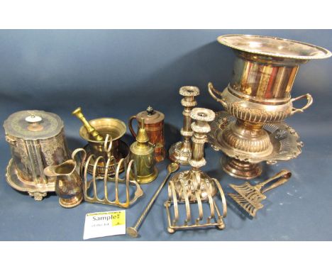 A varied selection of silver plated items including, a company shaped wine cooler, a Corinthian column table lamp (AF), a pai