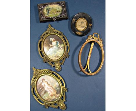 Five oval miniature portrait frames, three in gilt brass together with a 19th century French counterweight with oval tapestry