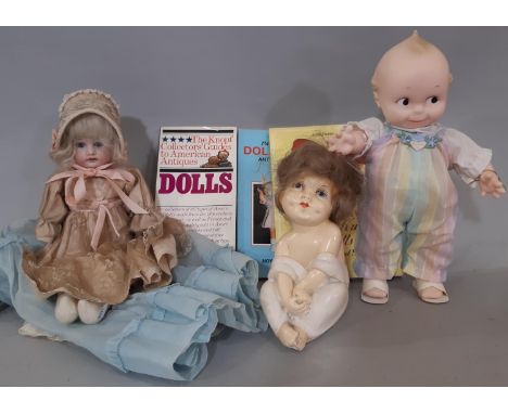 Mixed doll collection including an early 20th century bisque shoulder head doll by Armand Marseille with kid body, head marke