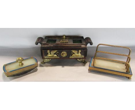 A 19th century letter rack with three gilded divisions set on a marble base with a two tone blue enamel surround and a matchi
