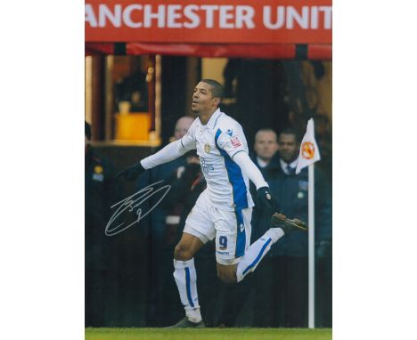 Autographed JERMAINE BECKFORD 16 x 12 Photo : Col, depicting Leeds United's JERMAINE BECKFORD running away in celebration aft