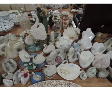 A selection of ceramic and similar model swan figures 
