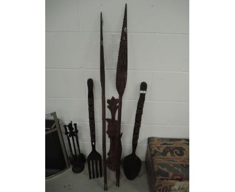 A pair of tribal art treen spears and similar fork and sppon
