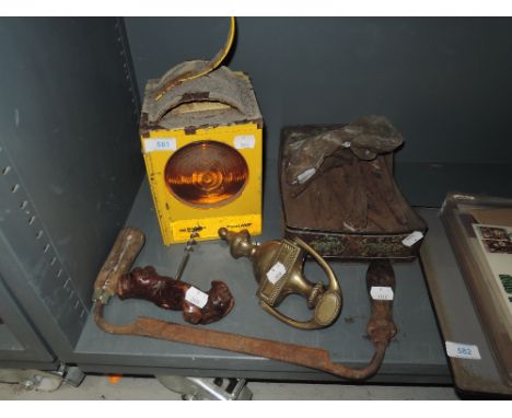 A selection of hardware items including punches, drawknife, safety lamp etc